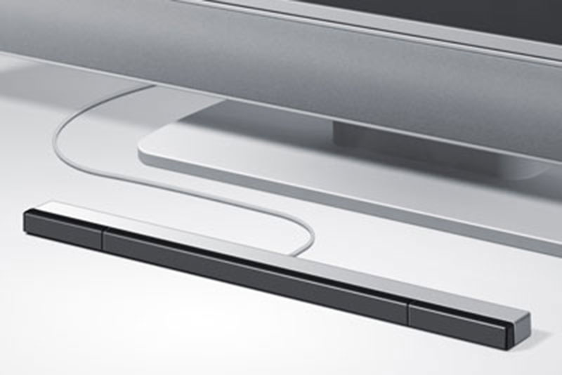 Photo of a Nintendo Wii “sensor bar,” positioned in front of a TV.