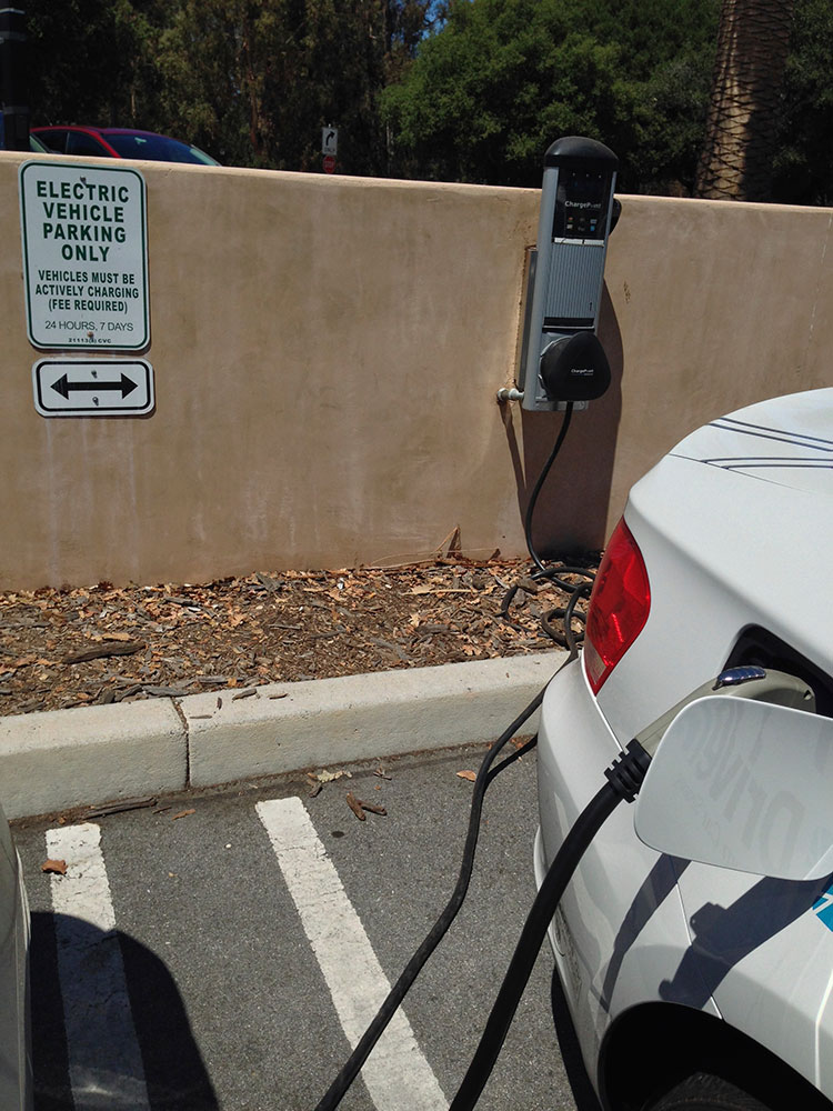 BMW ActiveE sedan, charging at a Chargepoint EV charge station.
